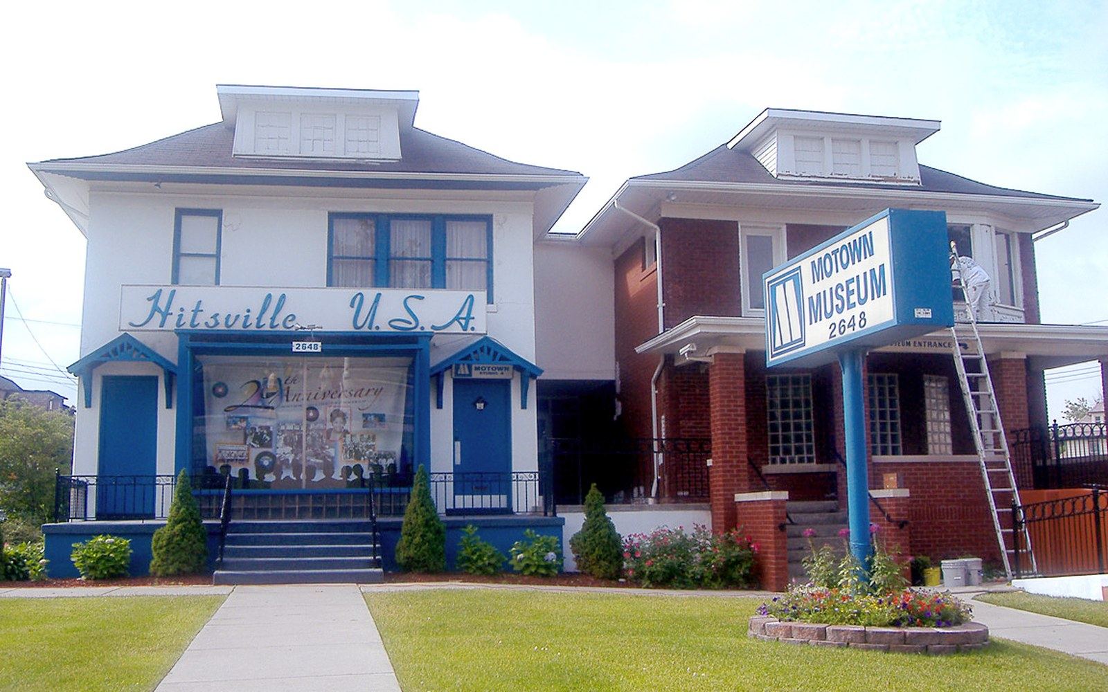 Hitsville U.S.A. building with blue trim and a Motown Museum sign on the lawn