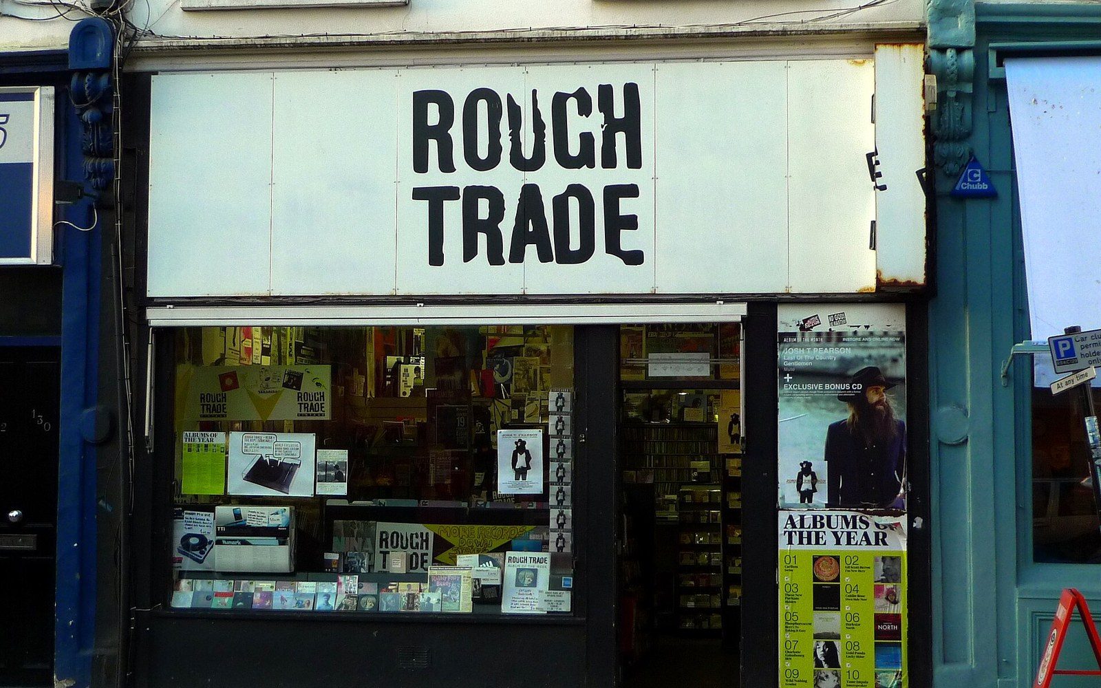 Rough Trade record shop storefront with window displays of albums and posters