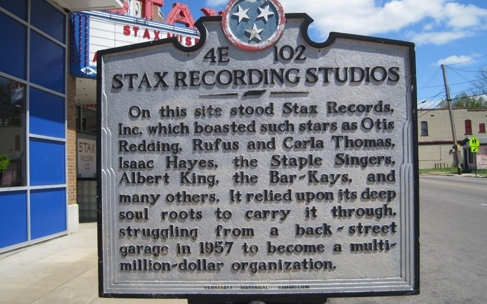 Historical marker for Stax Recording Studios stands outside the museum's marquee sign