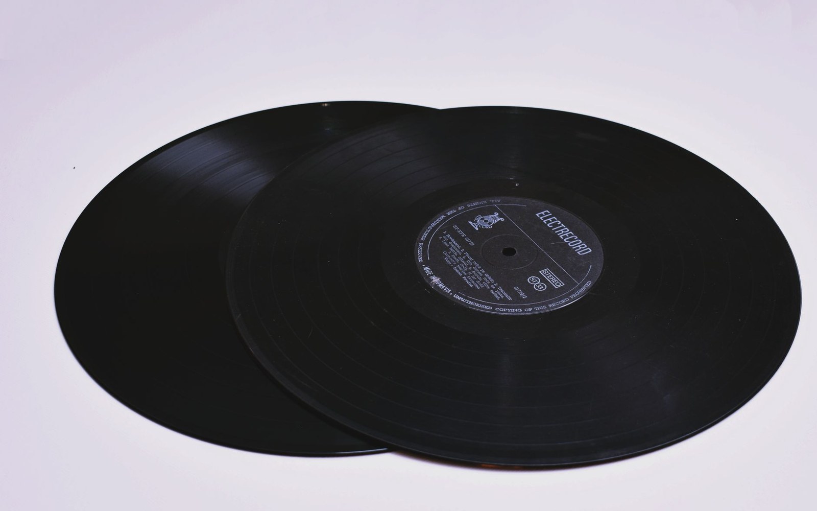 The yellow sunburst and rooster label of a Sun Records 45 rpm single, photographed square-on at close range
