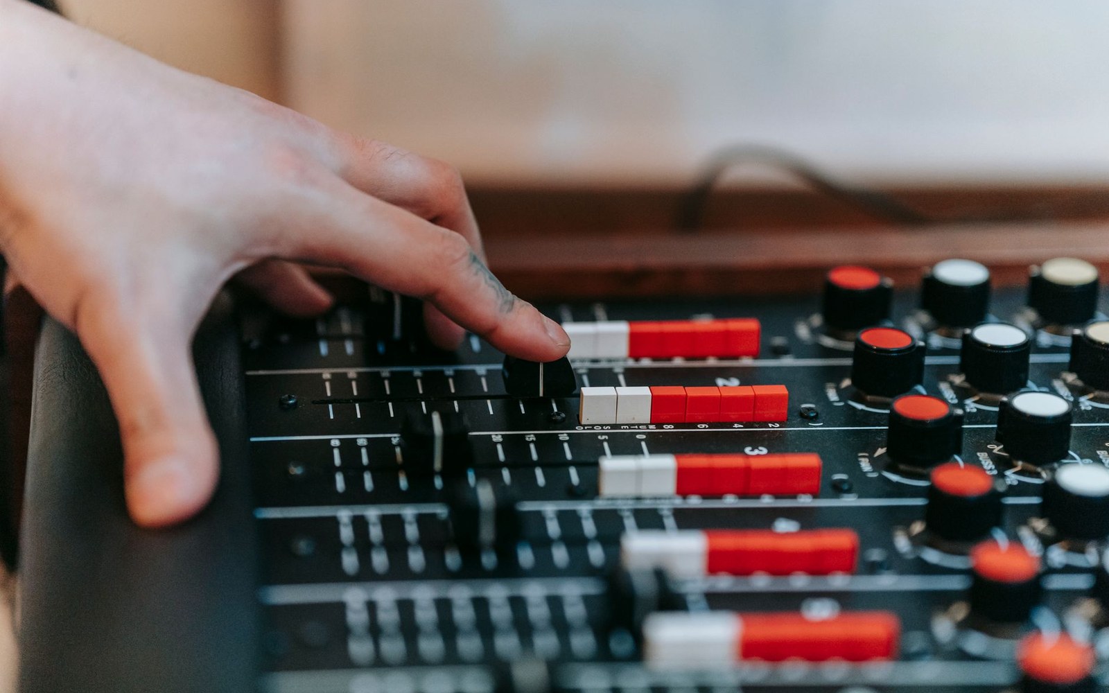 Rudy Van Gelder at the mixing console in his Englewood Cliffs studio, adult figure visible behind the board